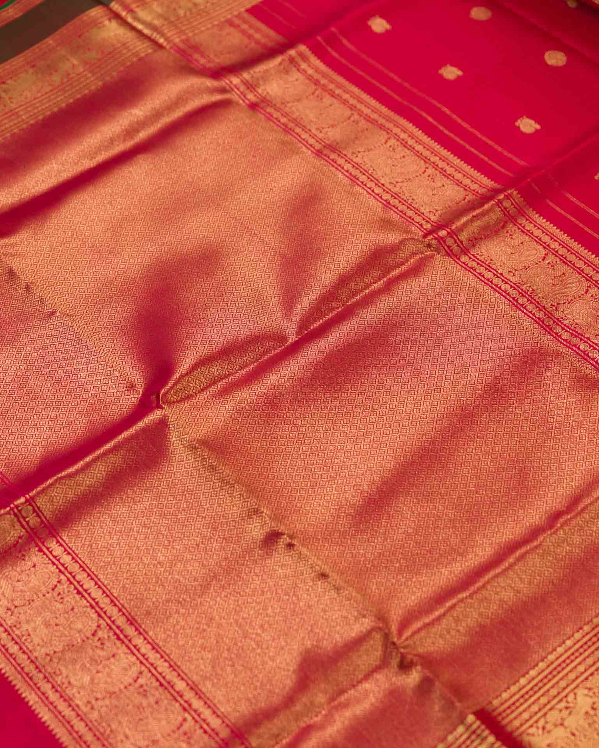 Pure kanjivaram in red with green Kora and Maggam work blouse