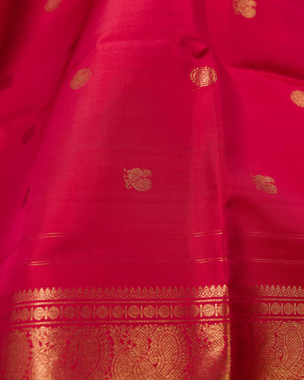 Pure kanjivaram in red with green Kora and Maggam work blouse
