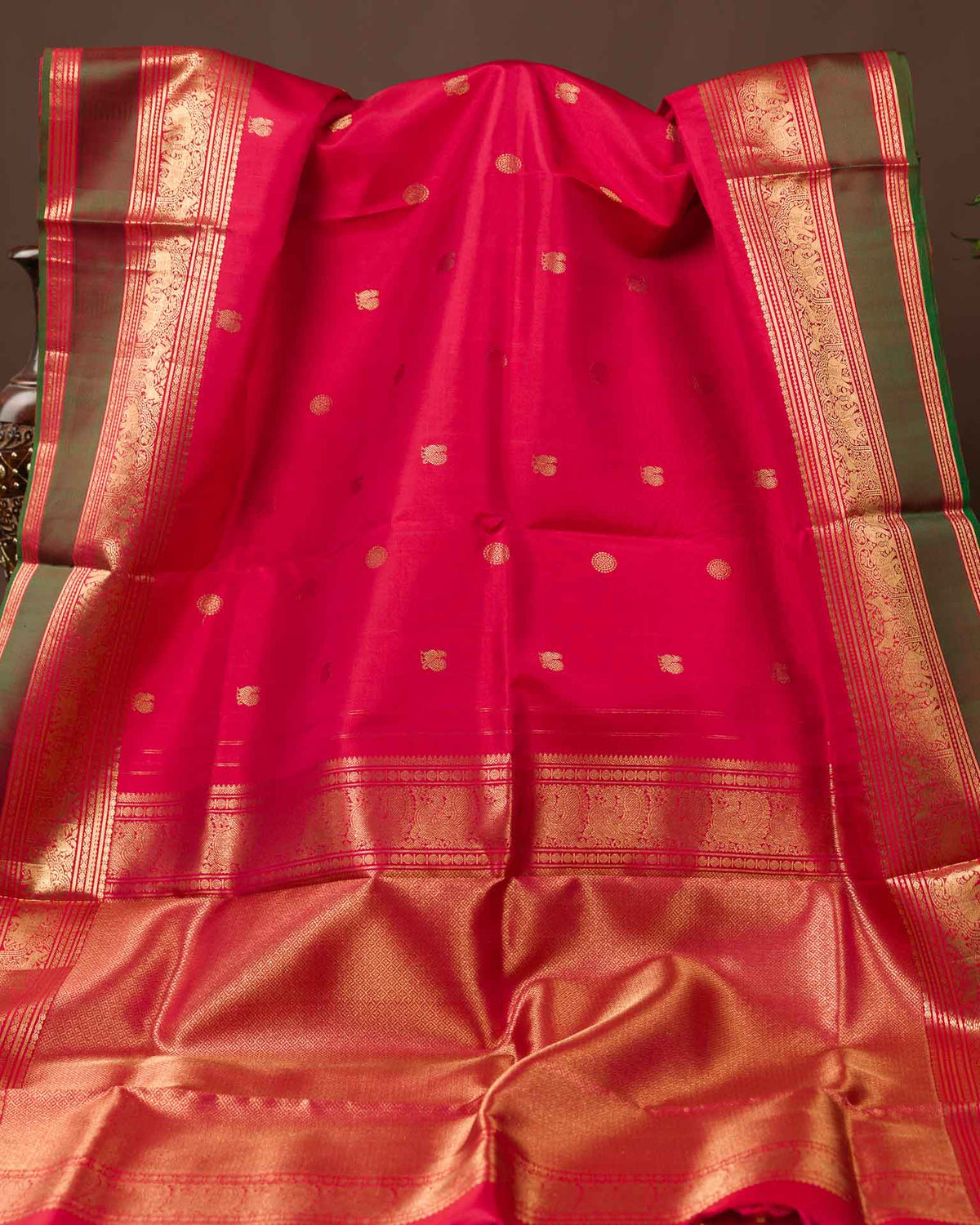 Pure kanjivaram in red with green Kora and Maggam work blouse