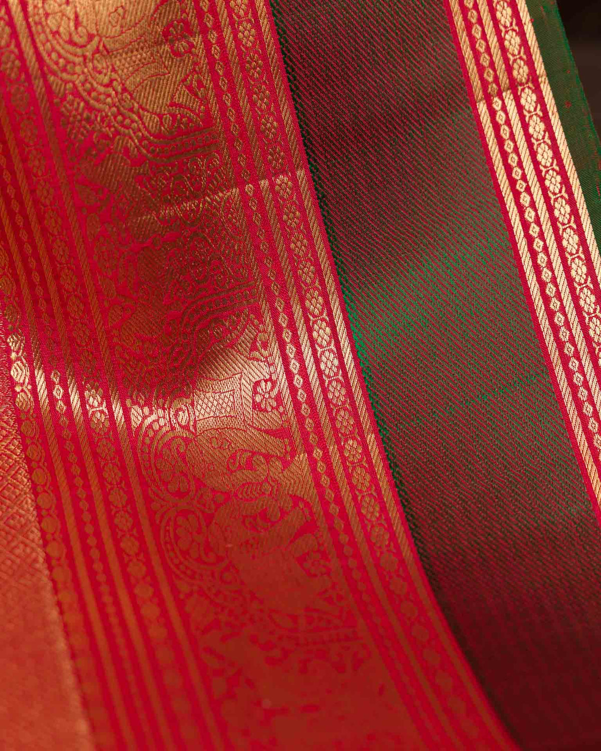 Pure kanjivaram in red with green Kora and Maggam work blouse