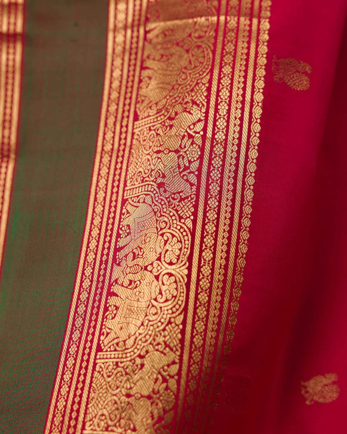 Pure kanjivaram in red with green Kora and Maggam work blouse