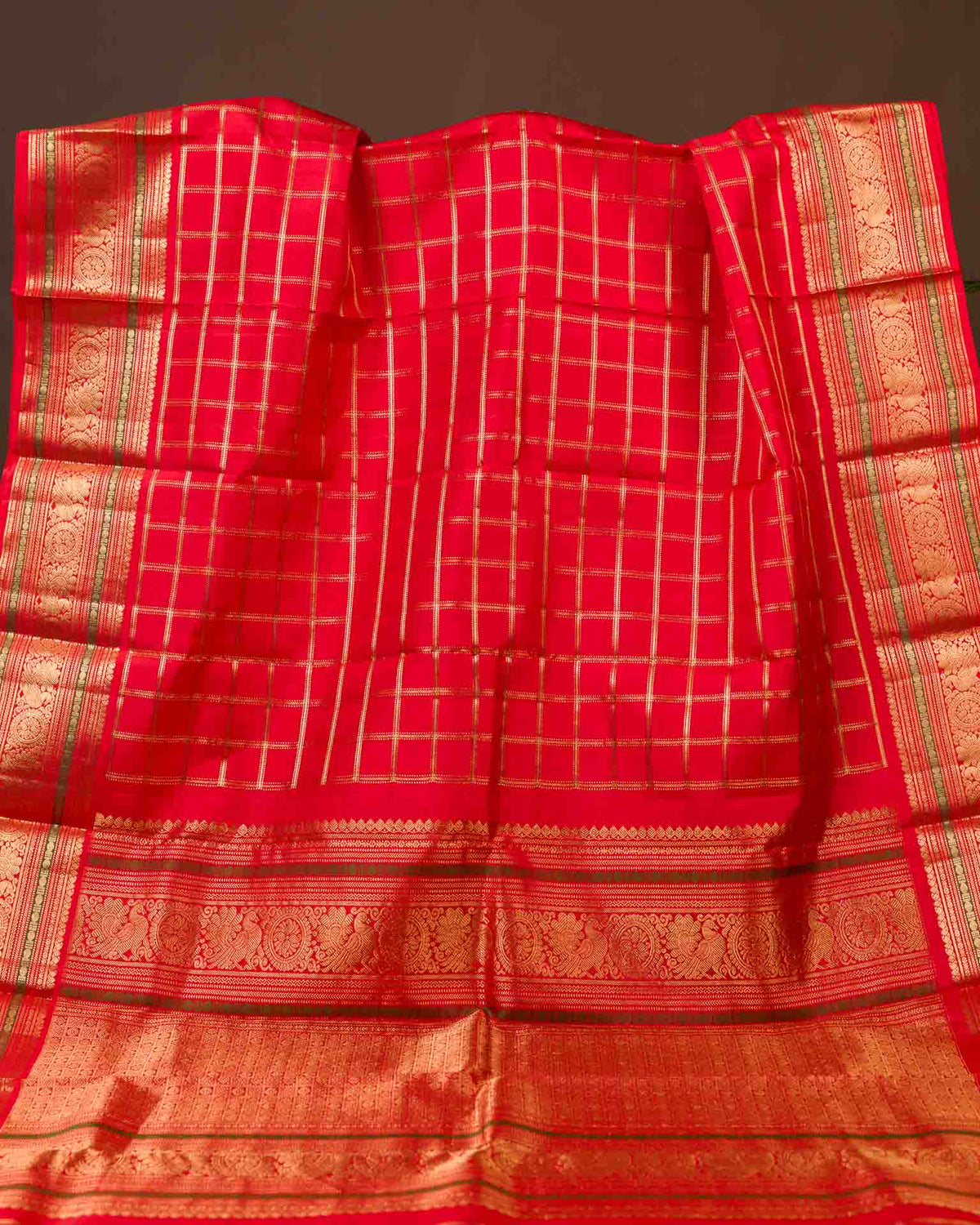 Pure kanjivaram in bright red with Maggam work blouse