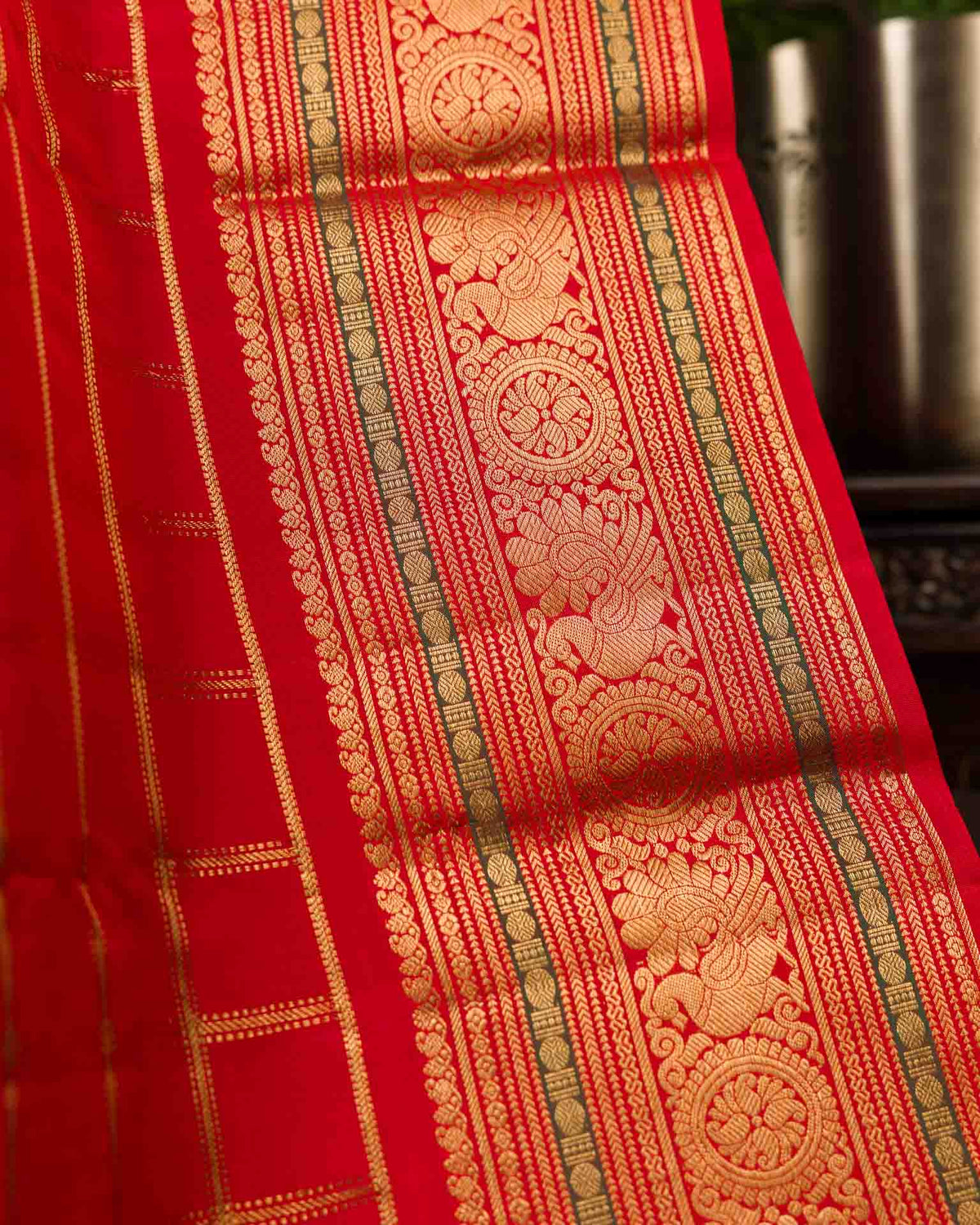 Pure kanjivaram in bright red with Maggam work blouse