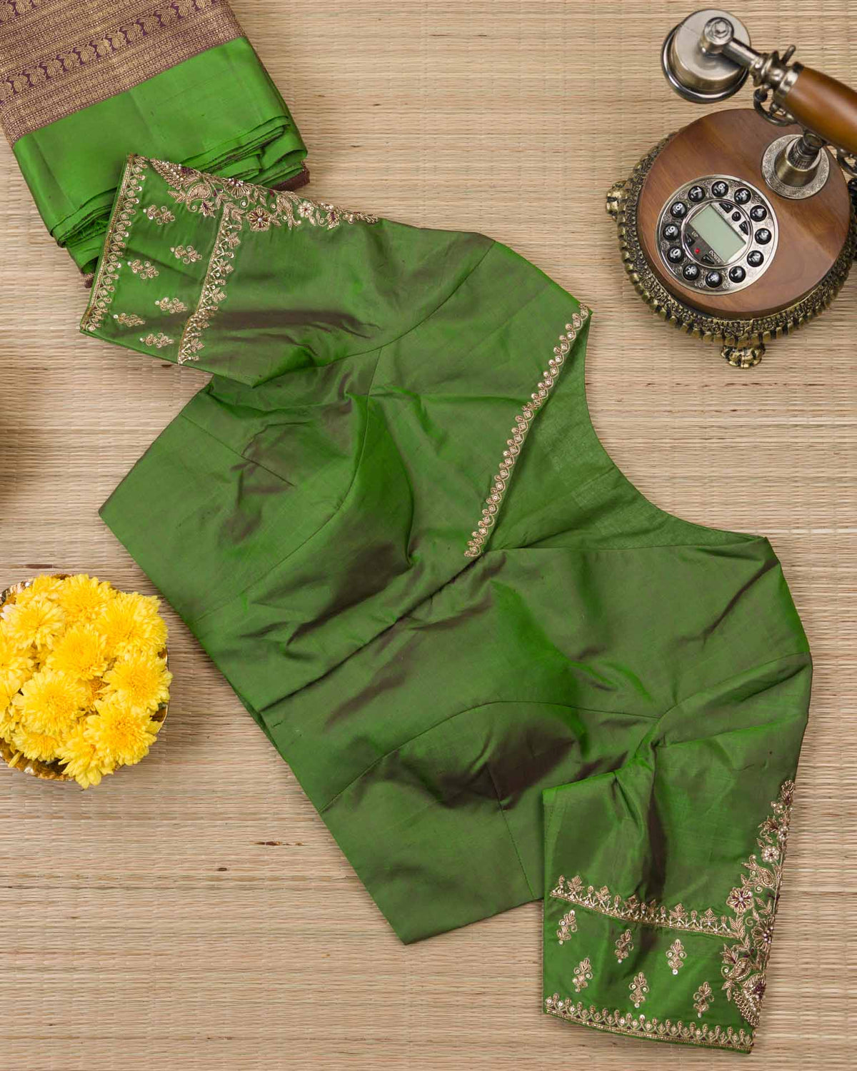 Pure kanjivaram with all over weave paired with Maggam work blouse