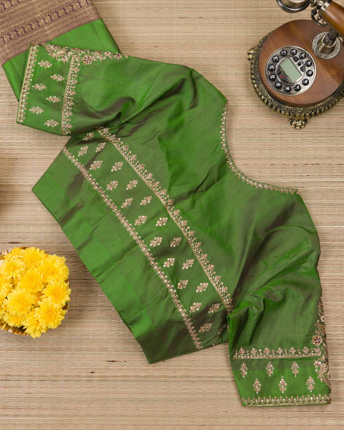 Pure kanjivaram with all over weave paired with Maggam work blouse