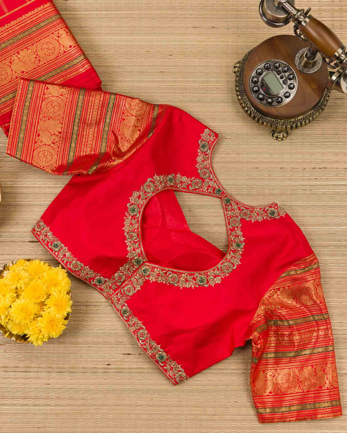 Pure kanjivaram in bright red with Maggam work blouse