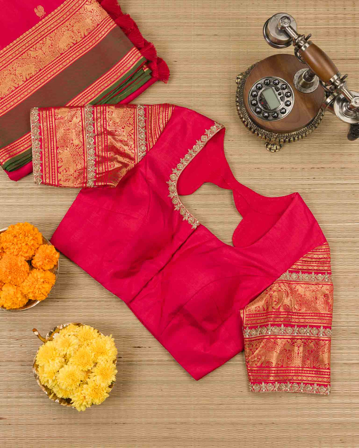 Pure kanjivaram in red with green Kora and Maggam work blouse