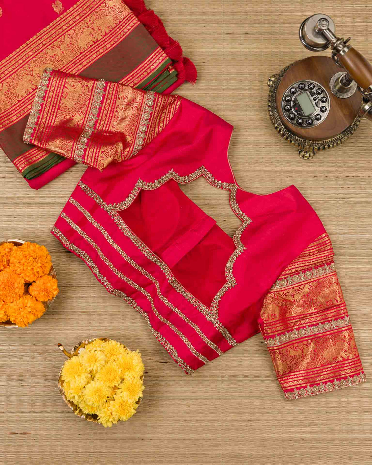 Pure kanjivaram in red with green Kora and Maggam work blouse