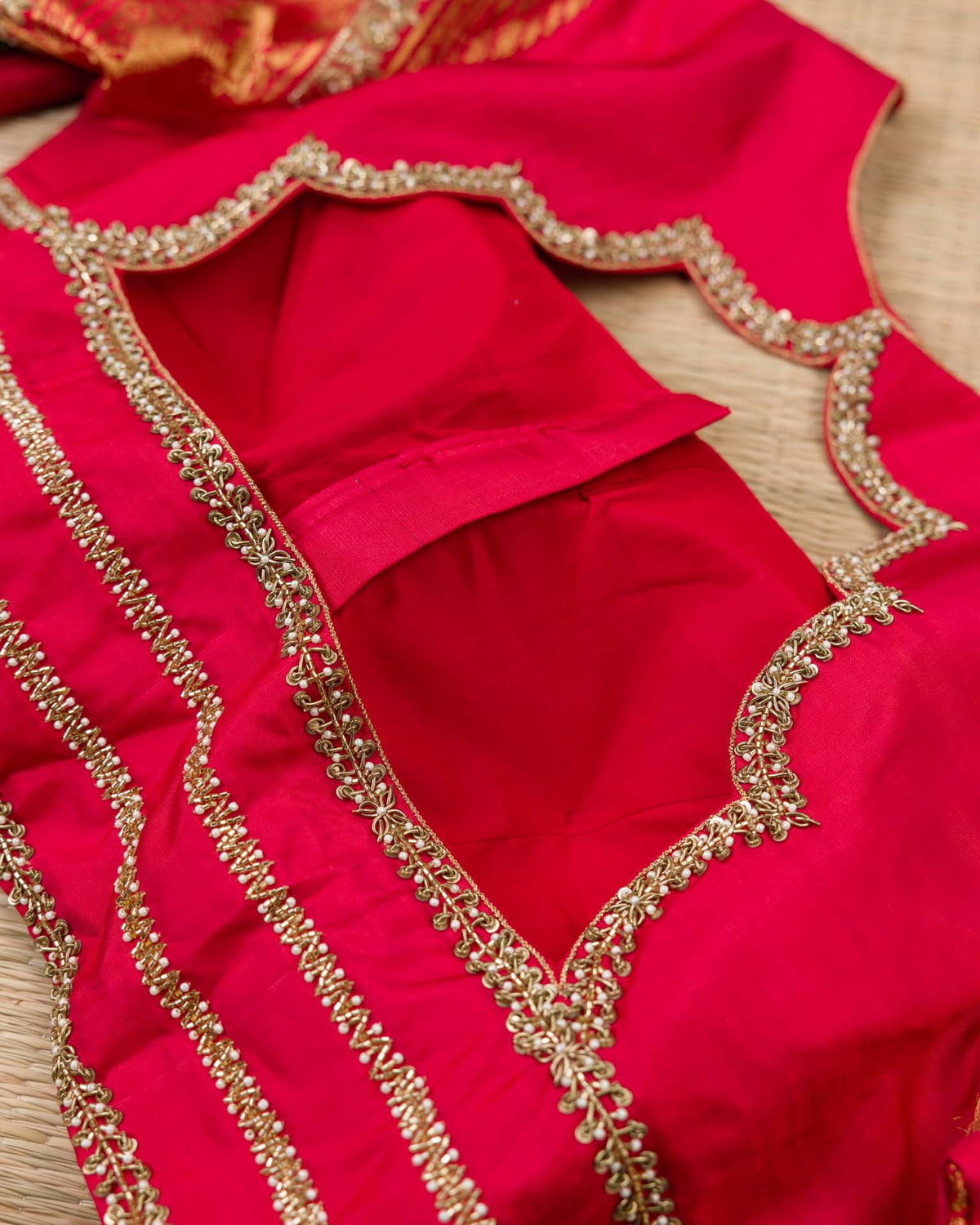 Pure kanjivaram in red with green Kora and Maggam work blouse